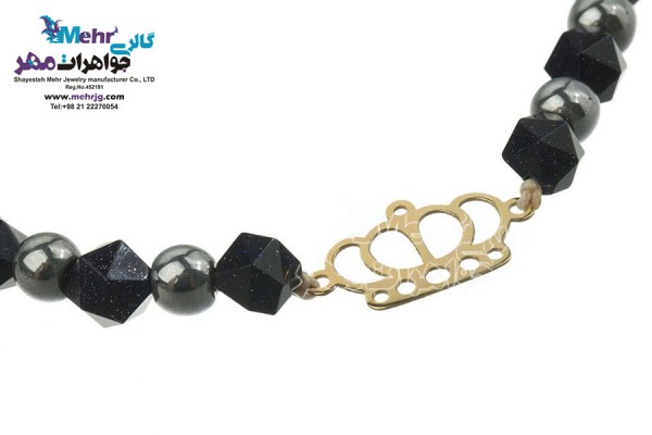 نمای دوم دستبند طلا و سنگ - طرح تاج