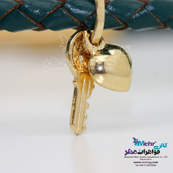 دستبند طلا و چرم - طرح قلب و کلید