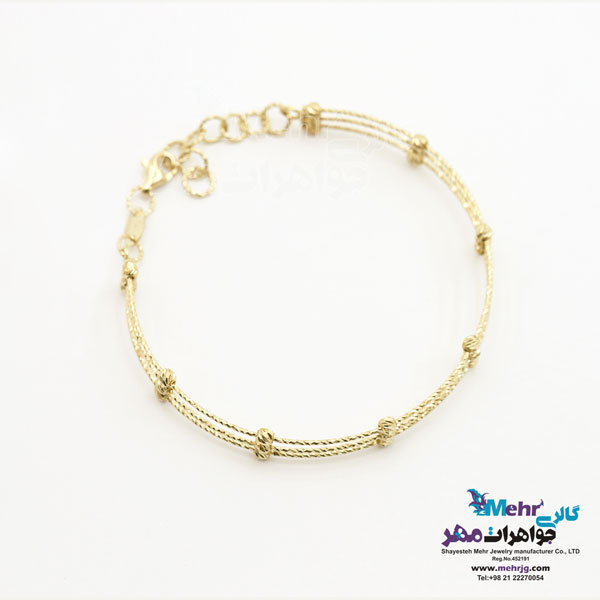 دستبند النگویی طلا - طرح گوی تراش